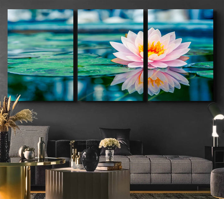 The Lotus Flower Canvas Print showcases a pink water lily with a yellow center gracefully floating on a calm pond.