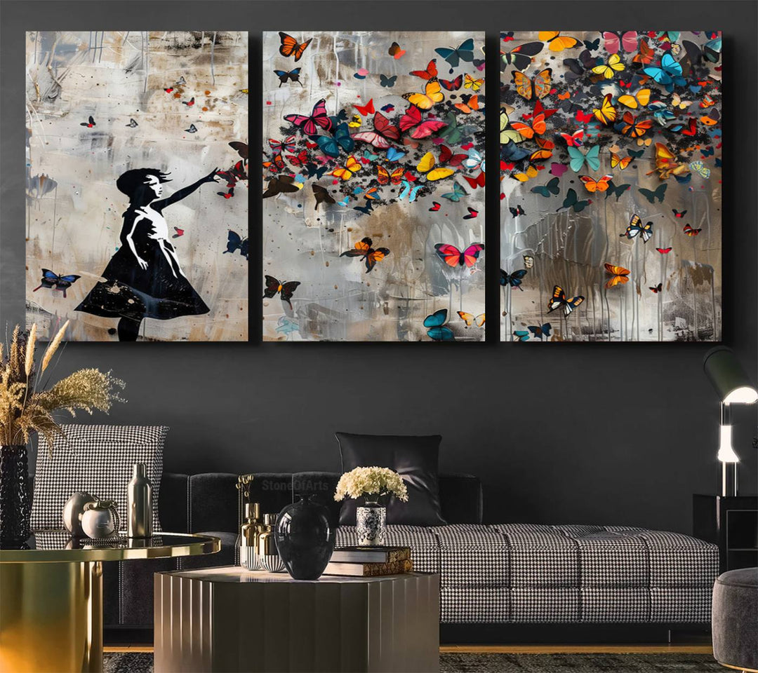 The Banksy Butterfly Girl 3-Piece Modern Graffiti Canvas Wall Art features a silhouette of a girl reaching for butterflies.