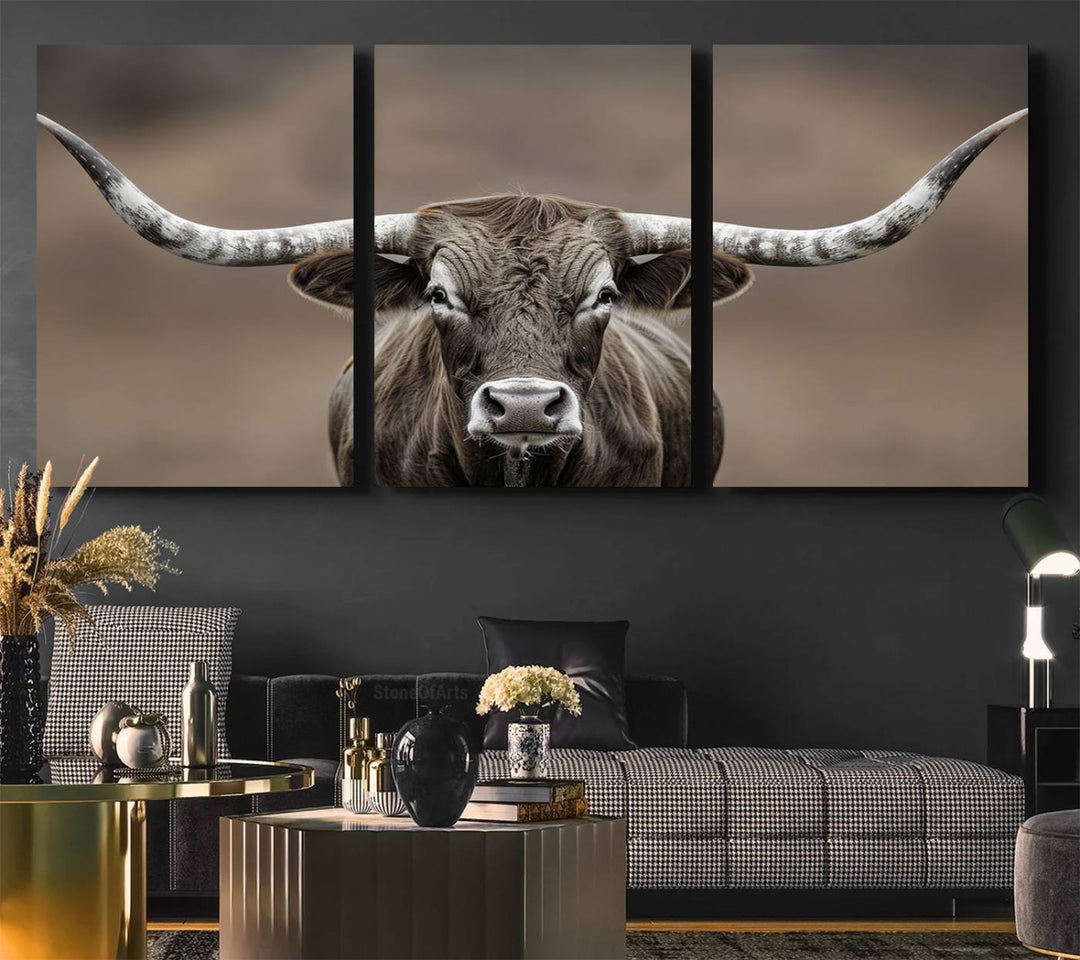 A close-up of a longhorn bull facing forward is featured in the Framed Texas Test-1, set against a blurred brown background.