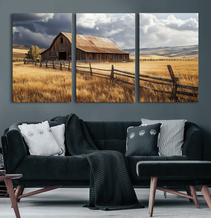 Canvas of a weathered wooden barn in a golden field under a dramatic sky, perfect for rustic or farmhouse-style wall decor.