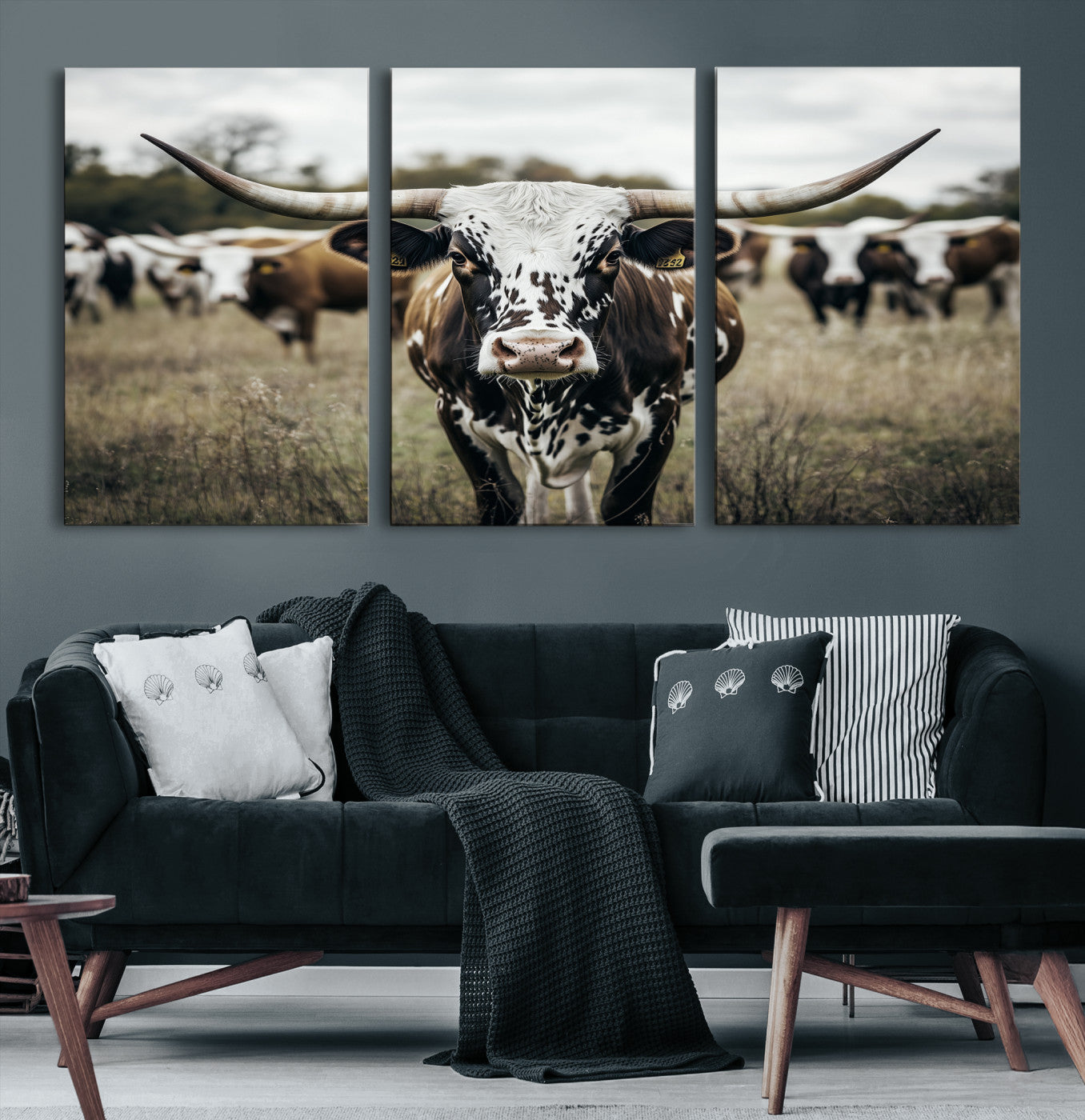 Canvas of a speckled Texas longhorn standing boldly in a field with a herd behind, perfect for rustic western or farmhouse wall decor.