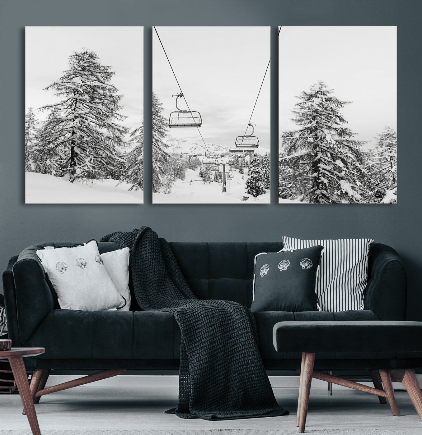 Black and white image of a ski lift amidst snow-covered pine trees, ideal for winter mountain or cabin-themed decor.