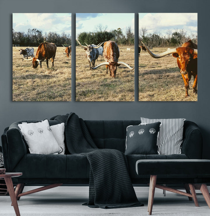 A herd of Texas Longhorn cattle grazing in an open field under a partly cloudy sky, capturing a rustic and Western ranch aesthetic.