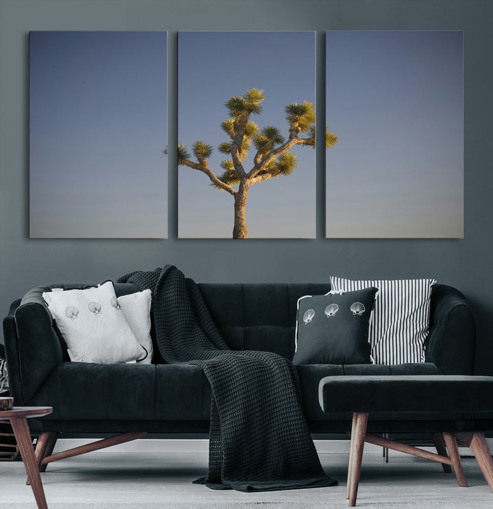 A lone Joshua Tree standing against a deep blue sky, capturing the serene and rugged beauty of the Southwestern desert landscape.