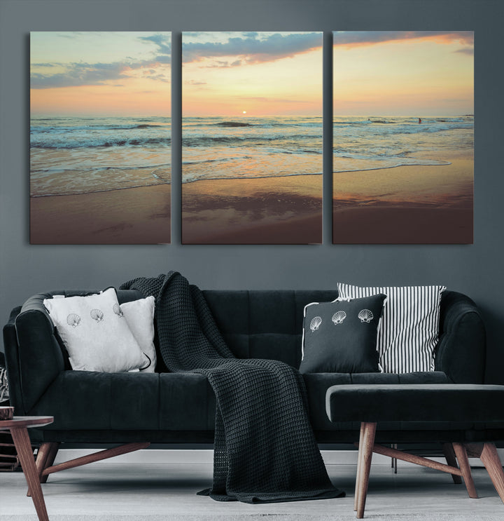 Warm sunset over gentle ocean waves with pastel sky and reflections on wet sand, creating a calm and soothing beach ambiance.