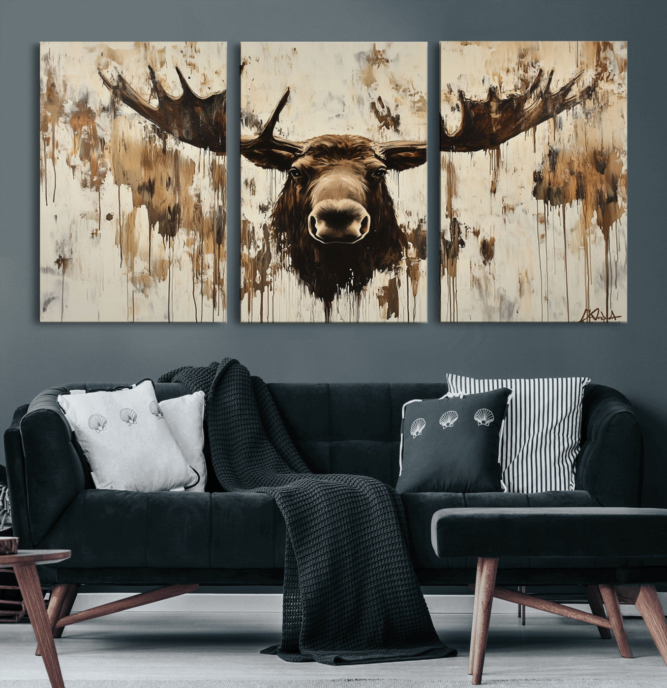 Expressive painting of a moose head with wide antlers in dark brown and beige tones, featuring paint drips and splatters on a light textured background, creating a striking rustic wall art canvas.