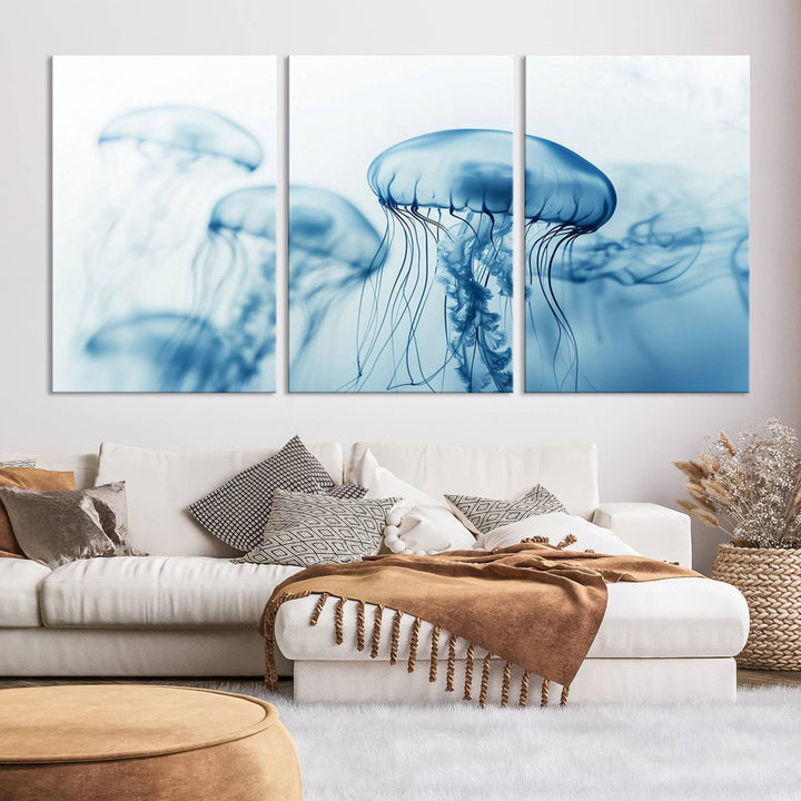 A breathtaking triptych of the Blue Jellyfish Wall Art Canvas Print decorates the space, beautifully highlighted by an overhead lamp. Each canvas is created on museum-quality material using high-resolution printing and includes a UV-protective coating to ensure long-lasting vibrancy.