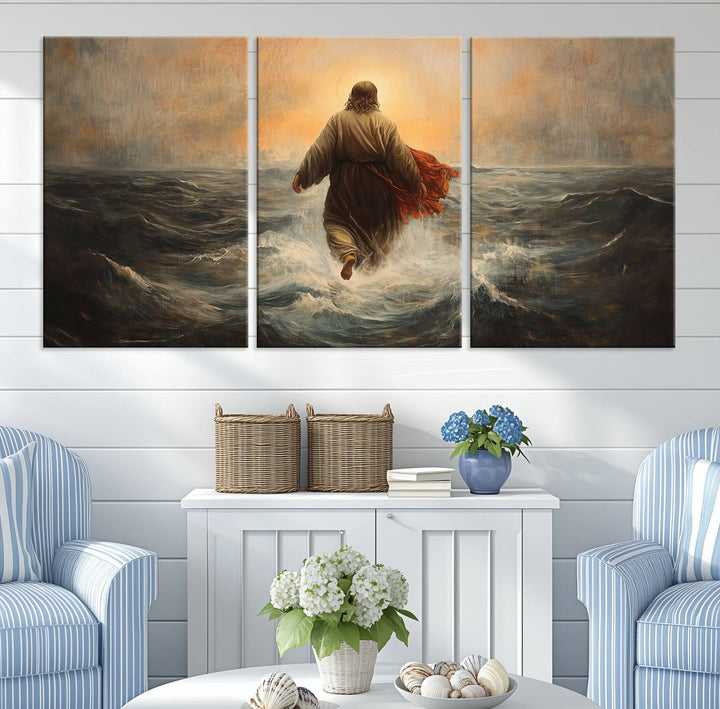 A modern living room is adorned with a triptych titled "Jesus Walking on Water, Christian Wall Art, Jesus Christ Walking on Oil Painting Style Print." The artwork, presented on museum-quality canvas, showcases vibrant colors and exquisite detail.