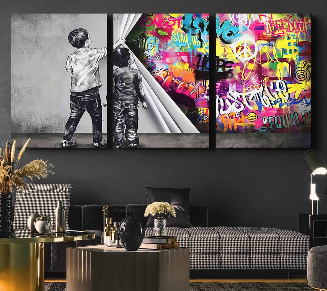 The Banksy Print - Street Art Canvas features a vibrant and bold image of two children lifting a curtain to reveal colorful graffiti. It's ready to hang, adding an urban modern decor vibe.