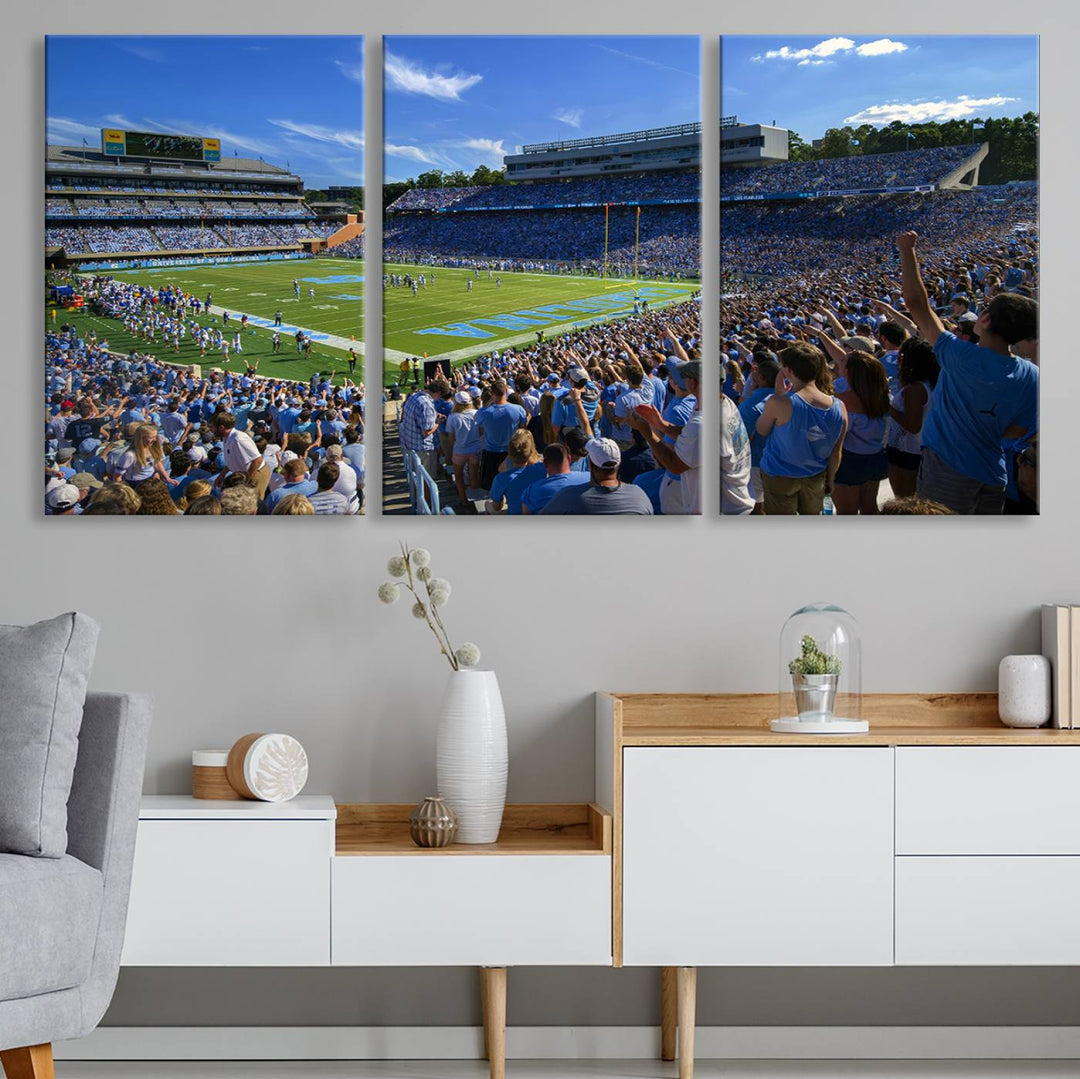 A gallery-quality canvas wall art print featuring the University of North Carolina Tar Heels Football Team and Chapel Hill's Kenan Memorial Stadium adorns the cafe wall.