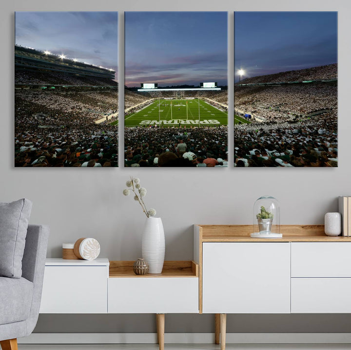 Wall art featuring a stadium at dusk with full stands—ideal for the Michigan State Spartans Football Team Canvas Print.