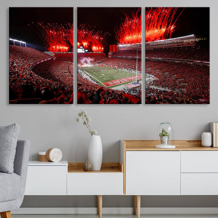 A vibrant red canvas art of a packed Ohio State Buckeyes stadium at night with fireworks.