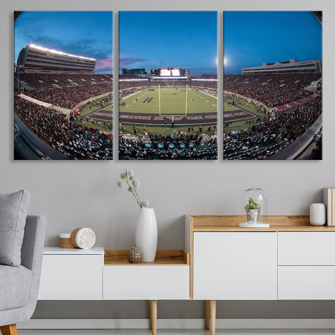 The wall art in the living room features a Texas Tech Red Raiders Football Team Print, showcasing Jones AT&T Stadium at dusk.