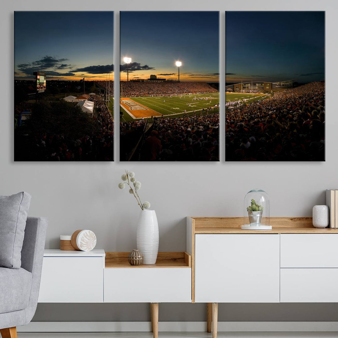 Ball State Cardinals Football Team Print - Muncie Scheumann Stadium Canvas featuring a sunset, floodlights, and lively crowd.