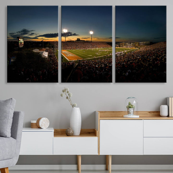 Ball State Cardinals Football Team Print - Muncie Scheumann Stadium Canvas featuring a sunset, floodlights, and lively crowd.