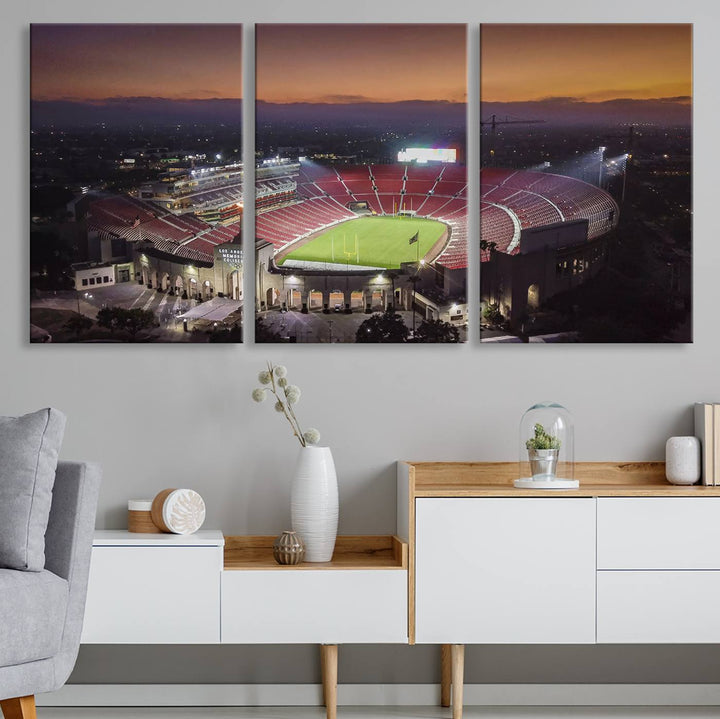 The USC Trojans Stadium canvas captures Memorial Coliseum at twilight, showcasing red seats and a green field beneath an orange sky.