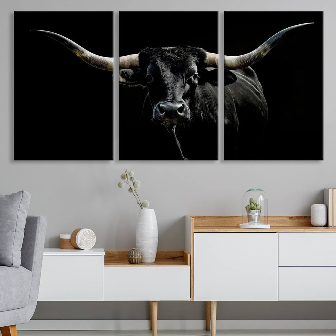 The Texas Black Longhorn Bull Canvas Print, featuring large curved horns set against a dark background, is ideal for Western decor.