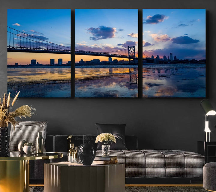 A photograph titled "Large Wall Art Philadelphia Canvas Print - Benjamin Franklin Bridge at Sunset" displays a breathtaking cityscape of the bridge reflected in the water. This image features a gallery-quality finish that promises to transform any space into an evocative memory.