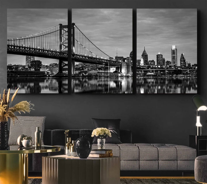 The "Large Wall Art Philadelphia Canvas Print" showcases a black-and-white depiction of the Ben Franklin Bridge with a water reflection.