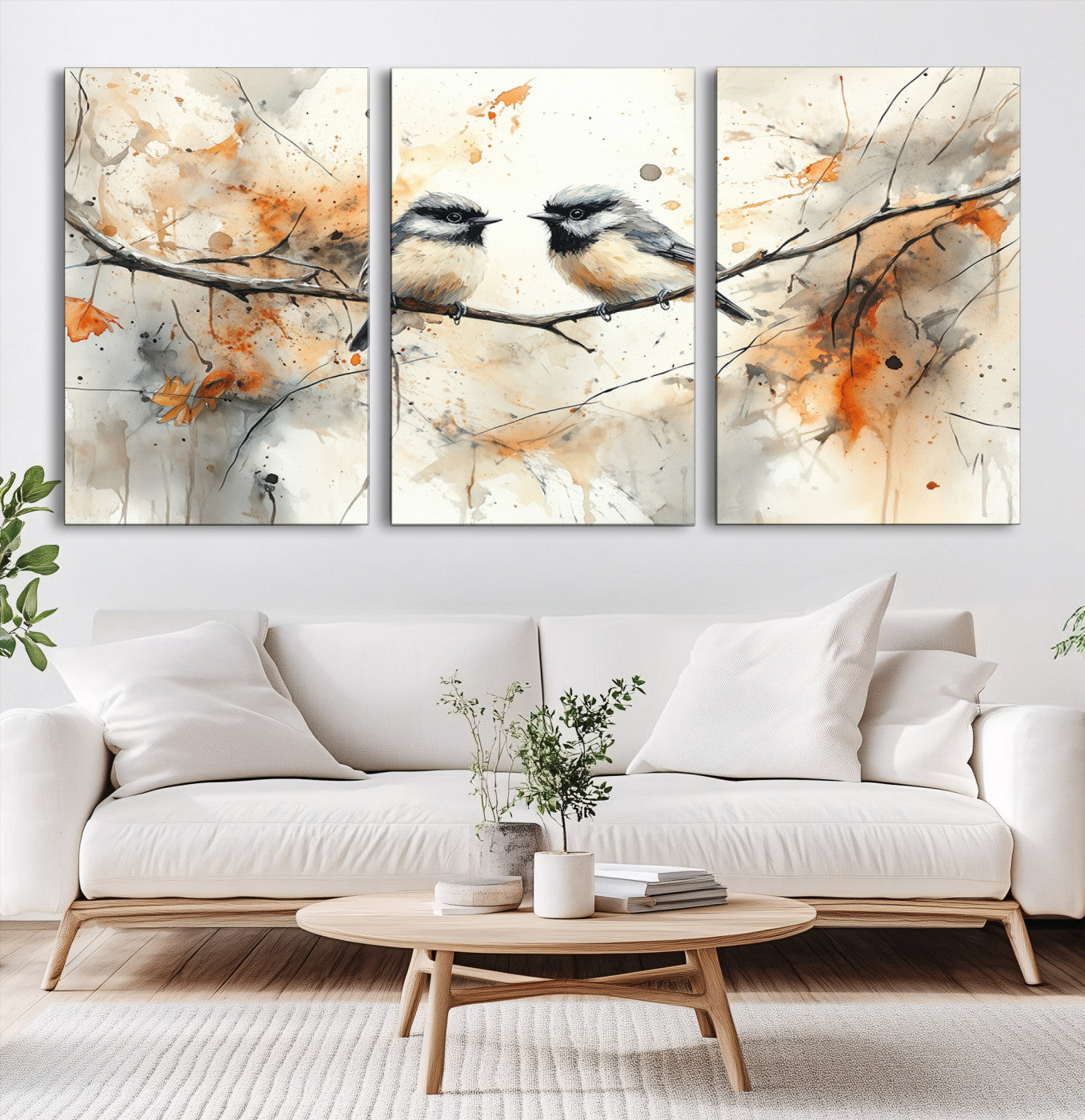 A soft and elegant watercolor painting of two chickadees perched on a delicate branch, surrounded by splashes of orange and neutral tones evoking a calm autumn day.