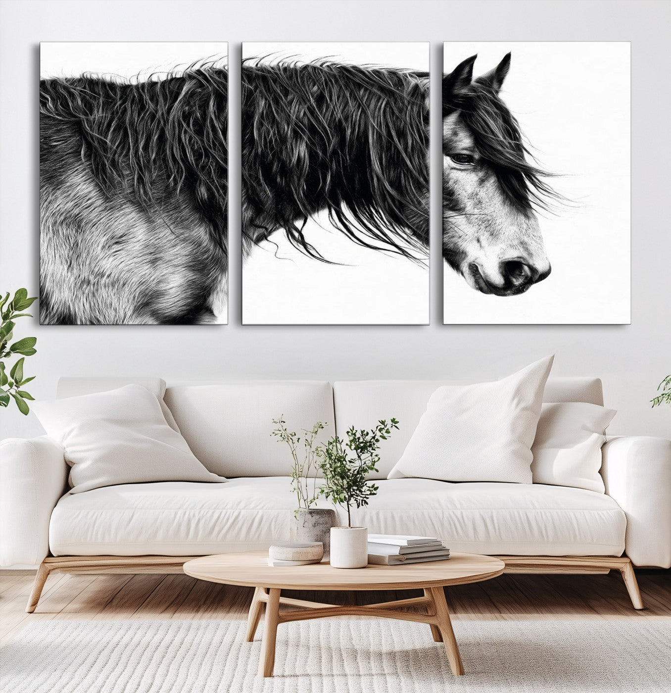 A stunning black-and-white portrait of a horse with a flowing mane, captured in dramatic detail and emotion.