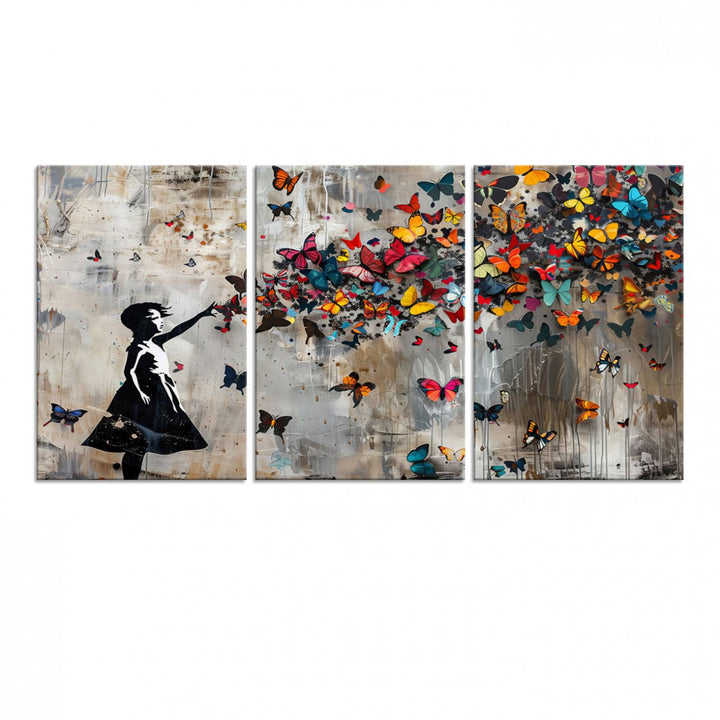 The Banksy Butterfly Girl 3-Piece Modern Graffiti Canvas Wall Art features a silhouette of a girl reaching for butterflies.