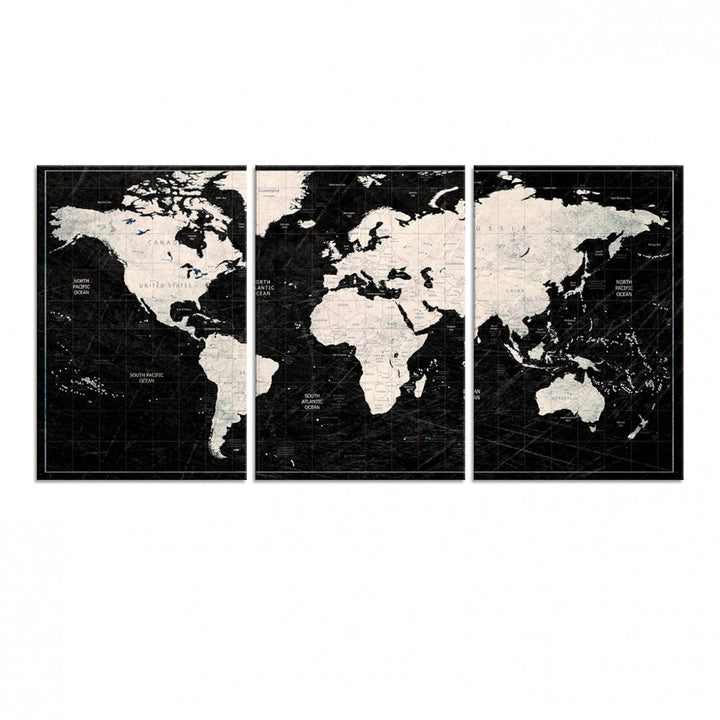 A bold global style framed black and white world map canvas print, presented in three panels, perfect for modern home or office decor.