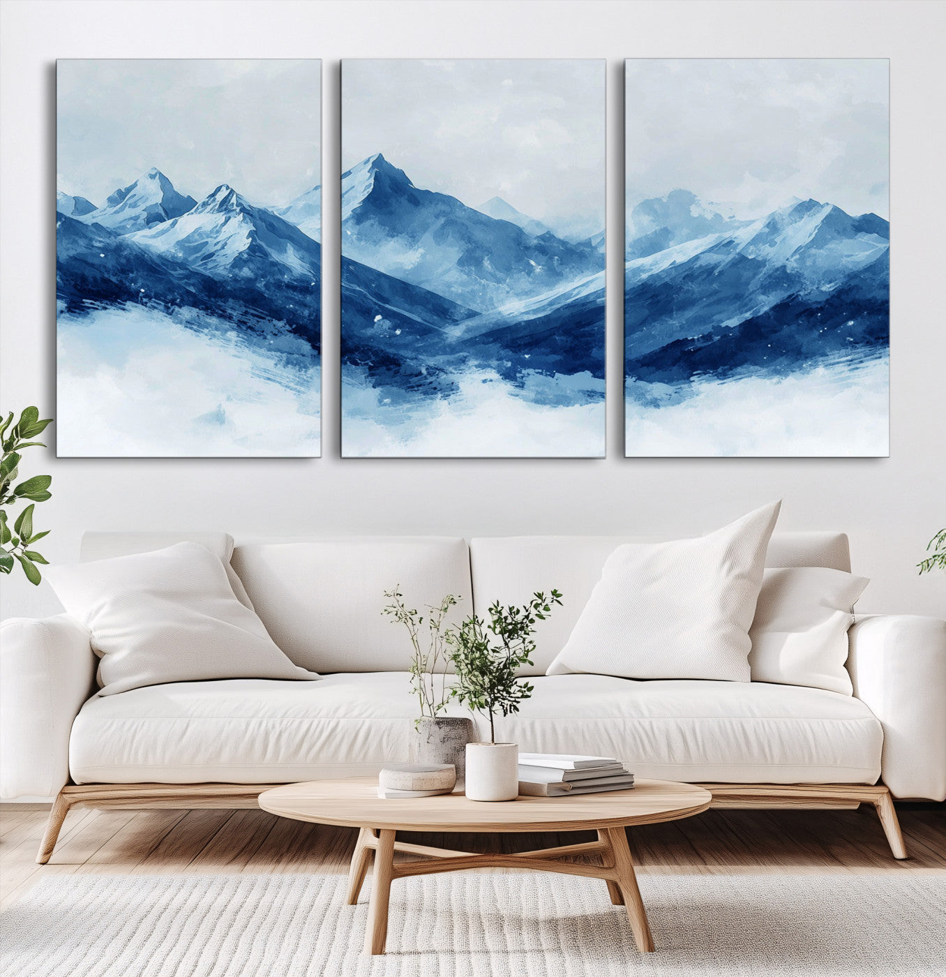 Peaceful watercolor-style painting of snowy blue mountains in soft tones, perfect for winter-themed or minimalist wall decor.