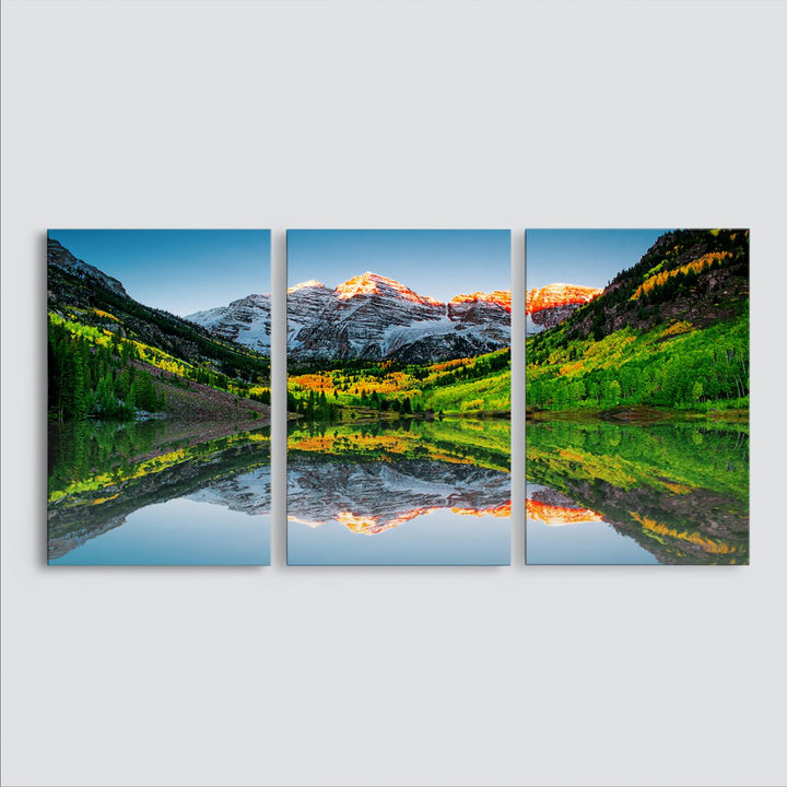 The Sunrise Maroon Bells Lake Wall Art Print beautifully captures North Maroon Peak mirrored in the tranquil lake, framed by lush greenery.