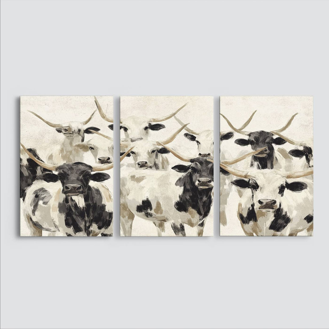 Canvas print titled Longhorn Texas Cow Drawing, depicting longhorn cattle with black and white markings, made in the USA, displayed on the wall.