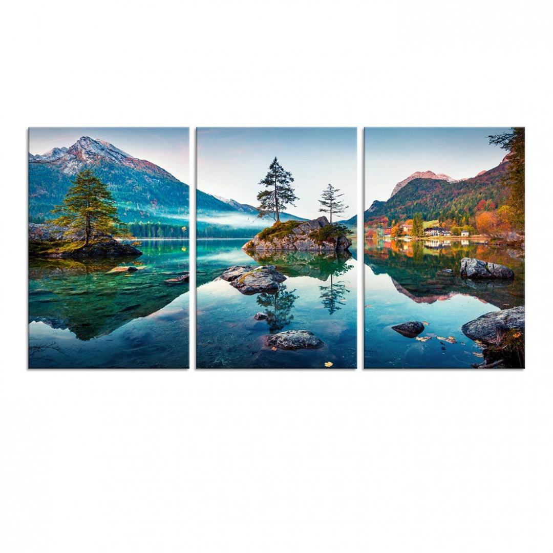 The 3-panel wall art showcases a serene mountain lake with rocky islands and trees, creating an ideal focal point for dining rooms or offices.