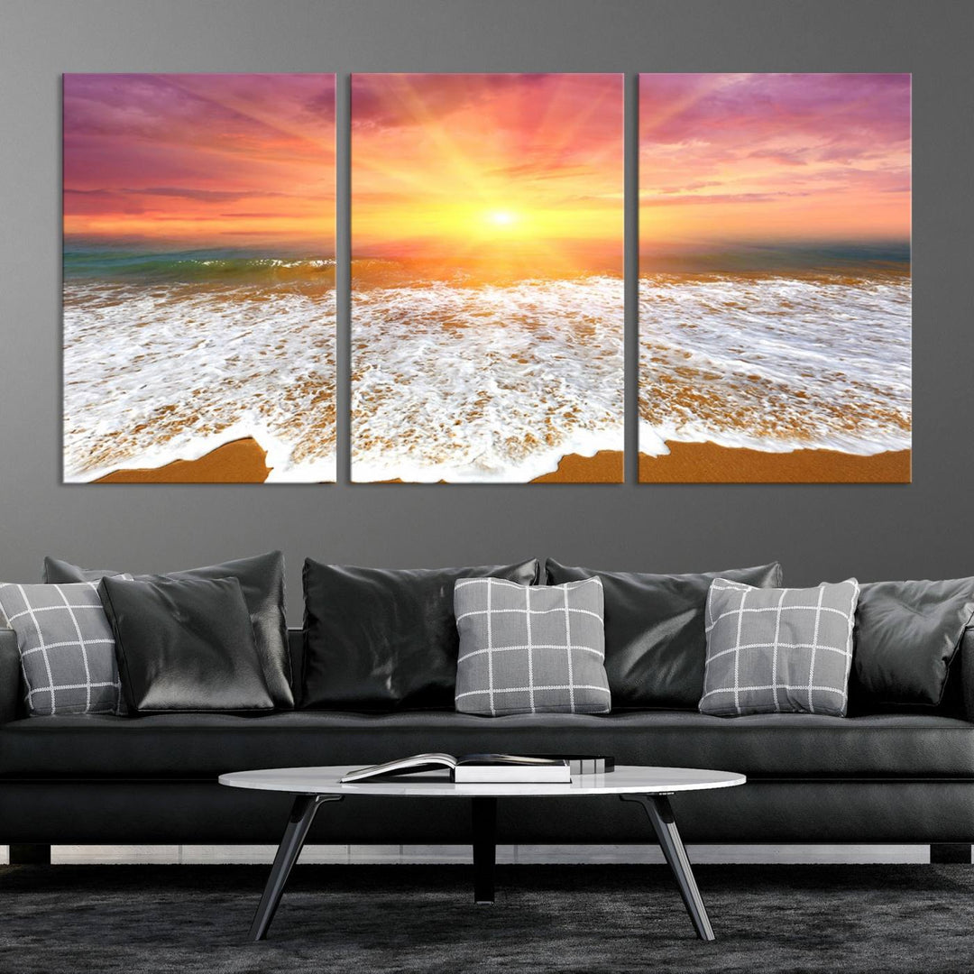 Golden Beach Sunrise 3-panel canvas art of ocean waves, hung on a wooden wall.