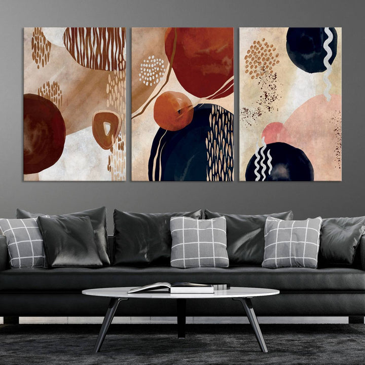 The Boho Neutral Canvas Print Set with earthy tones and circles hangs on the wall.