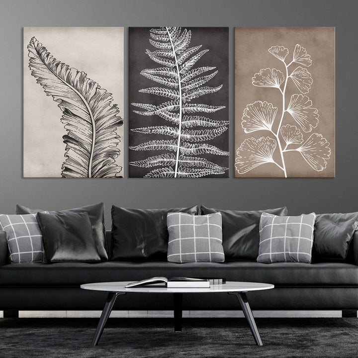 Three framed botanical wall art pieces are displayed in a bright room.