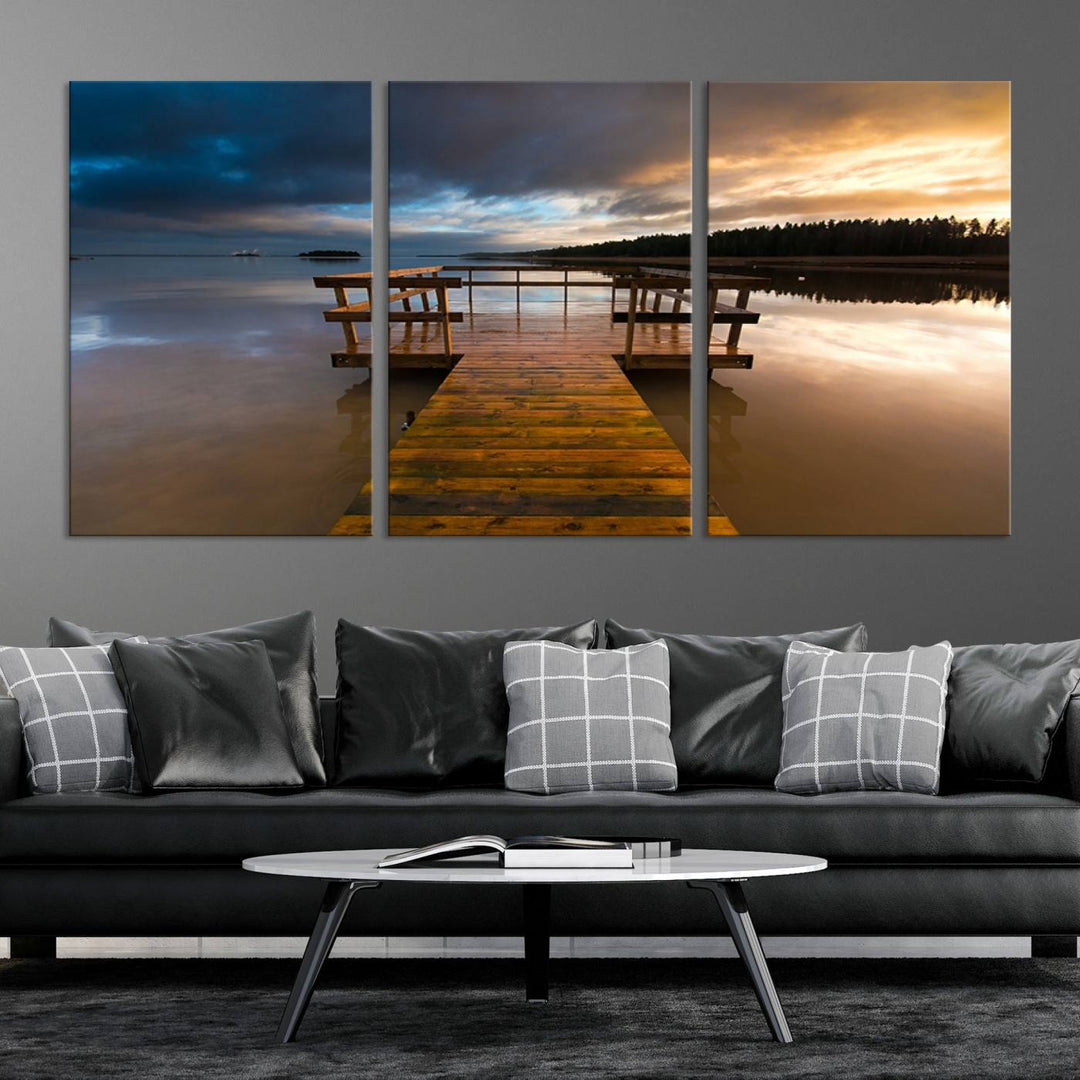 The "Serene Lake Pier at Sunset" landscape canvas print, crafted as ready-to-hang and framed wall art, enriches the contemporary setting by capturing the tranquility of a lakeside pier at sunset.