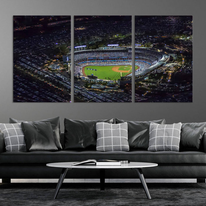 A stunning triptych of Dodger Stadium, captured in a brightly lit aerial view at night, adorns the wall. This Los Angeles Dodgers wall art is crafted with a gallery-quality finish on premium canvas.