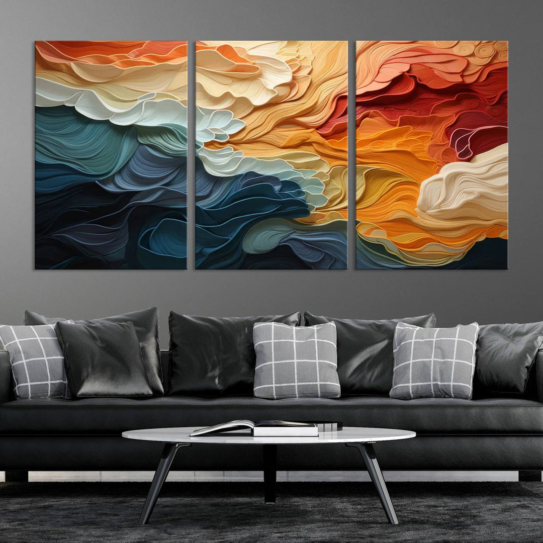 A Blue Orange Abstract Wave Wall Art Canvas Print adorns the wall. This colorful masterpiece is professionally hand-assembled to enhance any space.