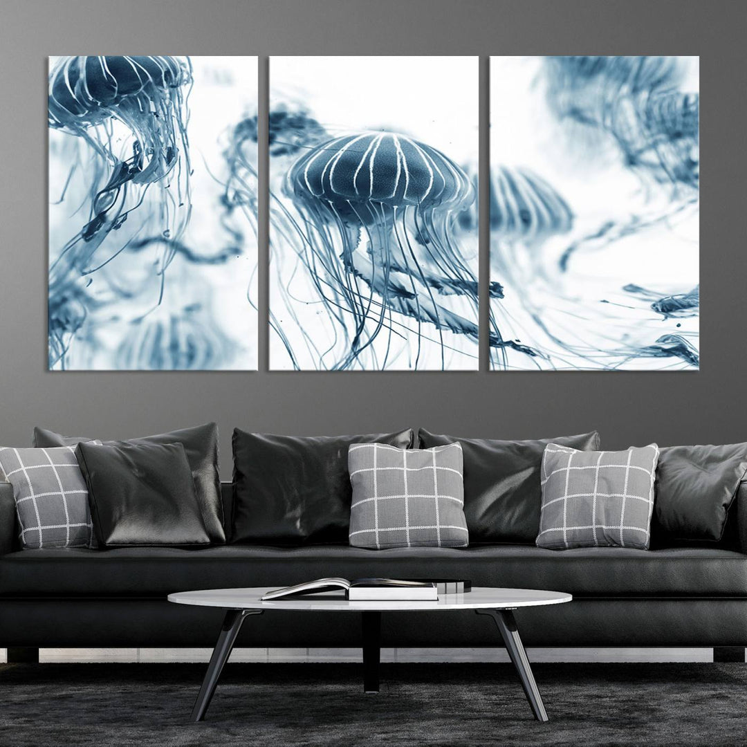 The "Abstract Jellyfish Wall Art Canvas Print" in high resolution is beautifully displayed as a triptych on a dark wall. Experience museum-quality canvas and enjoy free shipping with this stunning piece.