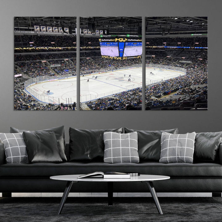 A large Enterprise Center canvas of a crowded hockey arena hangs prominently.