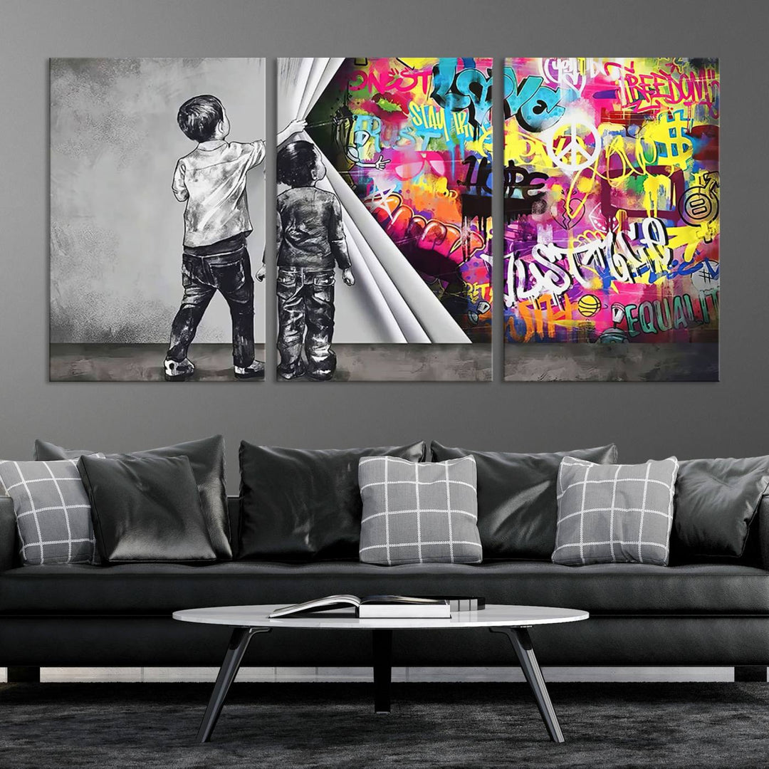 The Banksy Print - Street Art Canvas features a vibrant and bold image of two children lifting a curtain to reveal colorful graffiti. It's ready to hang, adding an urban modern decor vibe.