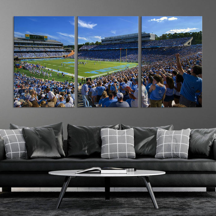 A gallery-quality canvas wall art print featuring the University of North Carolina Tar Heels Football Team and Chapel Hill's Kenan Memorial Stadium adorns the cafe wall.