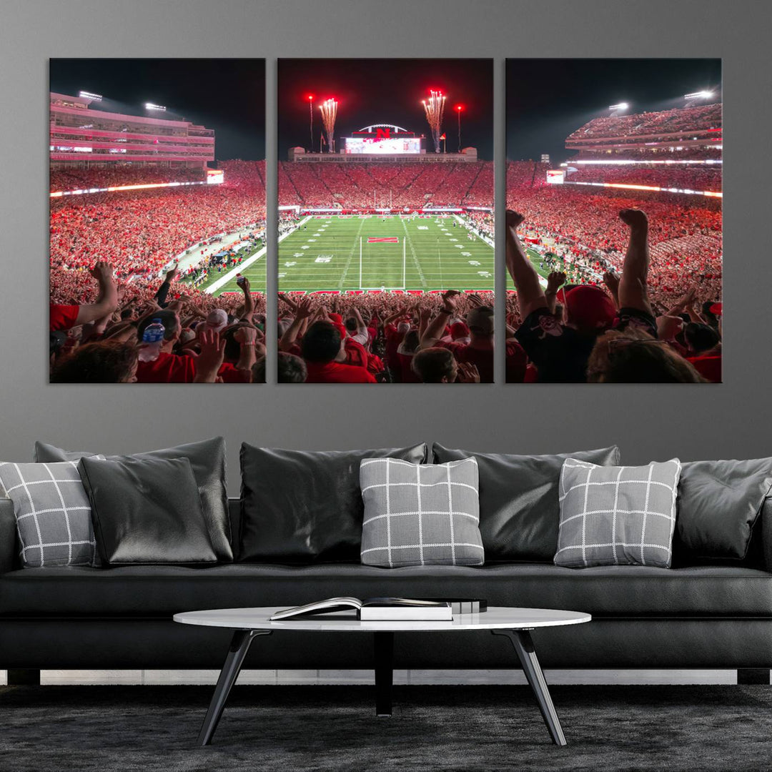 The University of Nebraska Cornhuskers Football Team Print, a vibrant three-panel canvas depicting Lincoln Memorial Stadium filled with enthusiastic fans from the end zone perspective, features a gallery-quality finish.