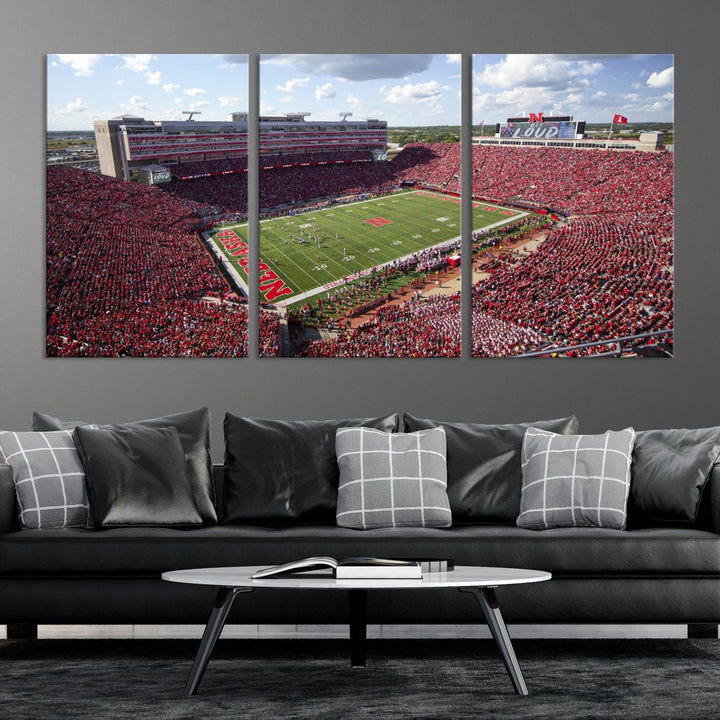 The University of Nebraska Cornhuskers Football Team Print showcases a vibrant triptych of Lincoln Memorial Stadium, depicting a packed football stadium filled with energetic fans. This handmade art piece is crafted in the USA and printed on premium canvas for a gallery-quality finish.