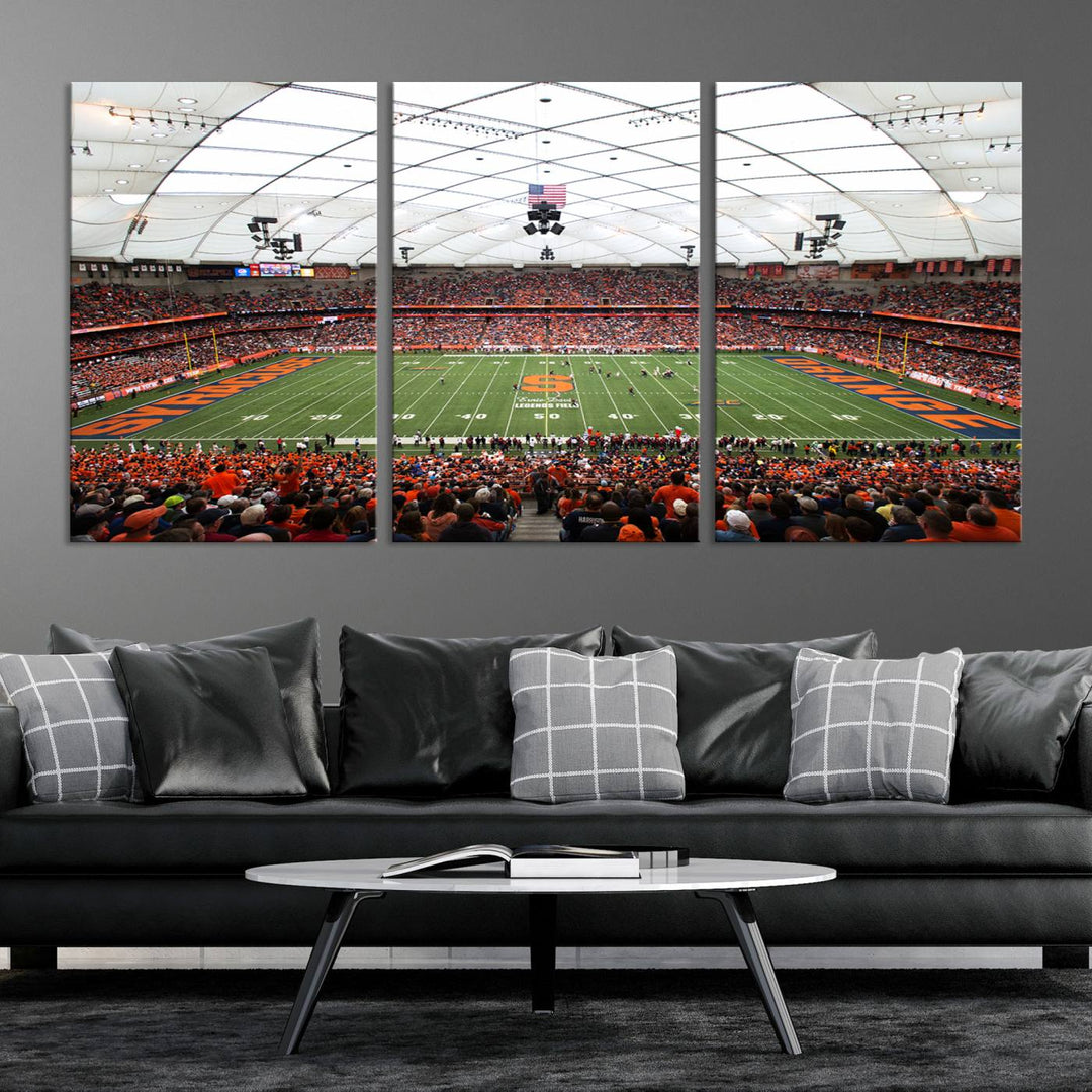 Fans fill the Syracuse JMA Wireless Dome, highlighted in orange and blue under a vaulted roof on this premium canvas print of the scene.