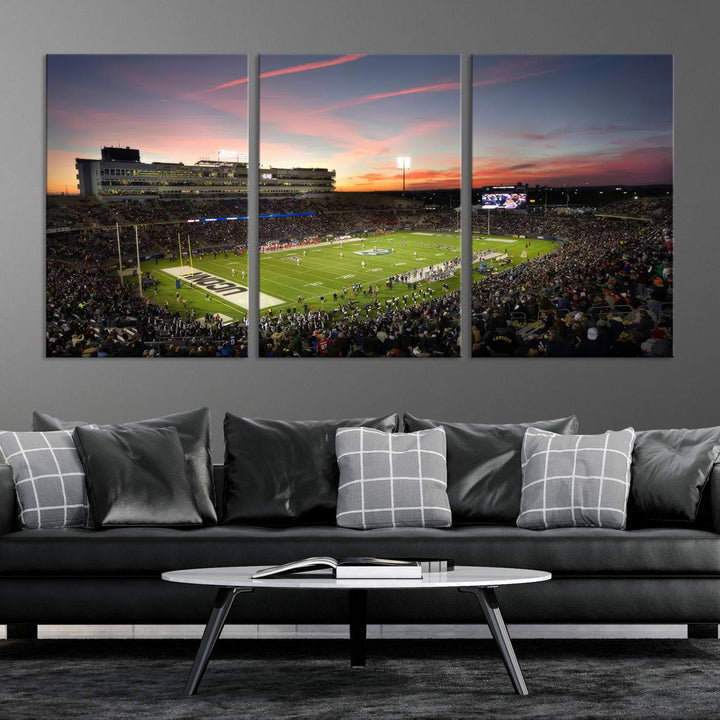 This wall art canvas print captures UCONN Huskies fans energizing a sunset scene at East Hartfords Pratt & Whitney Stadium.