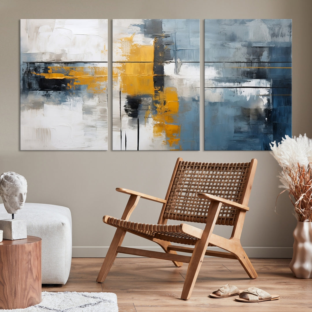 The Orange Abstract Wall Art Print features a series of white, blue, black, and yellow blocks arranged in a triptych format on museum-quality canvases. Proudly made in the USA and offered with free shipping.