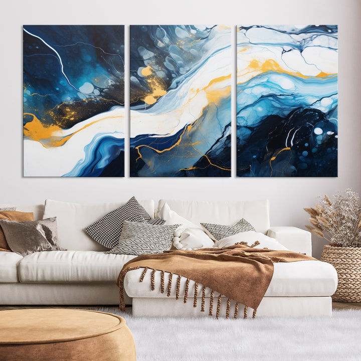 The Navy Blue Abstract Wall Art Canvas Print, displaying an exquisite array of blue, white, and gold swirls, is crafted on museum-quality canvas and enhances the space with its sophisticated elegance.