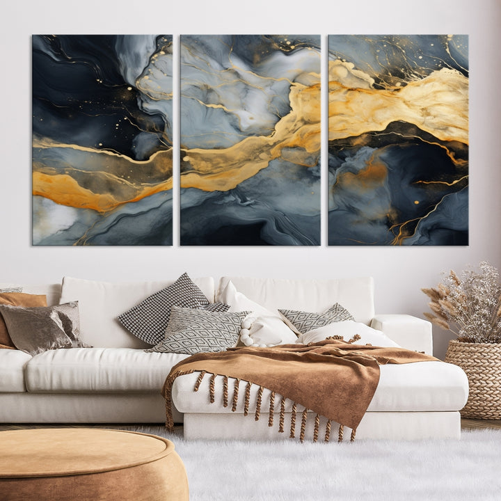 The living room features the Golden Gray Abstract Wall Art Print Contemporary Art Canvas Design, a triptych showcasing gold, black, and gray swirls. Crafted on museum-quality canvas and ready to hang, this piece is designed for elegance and durability.