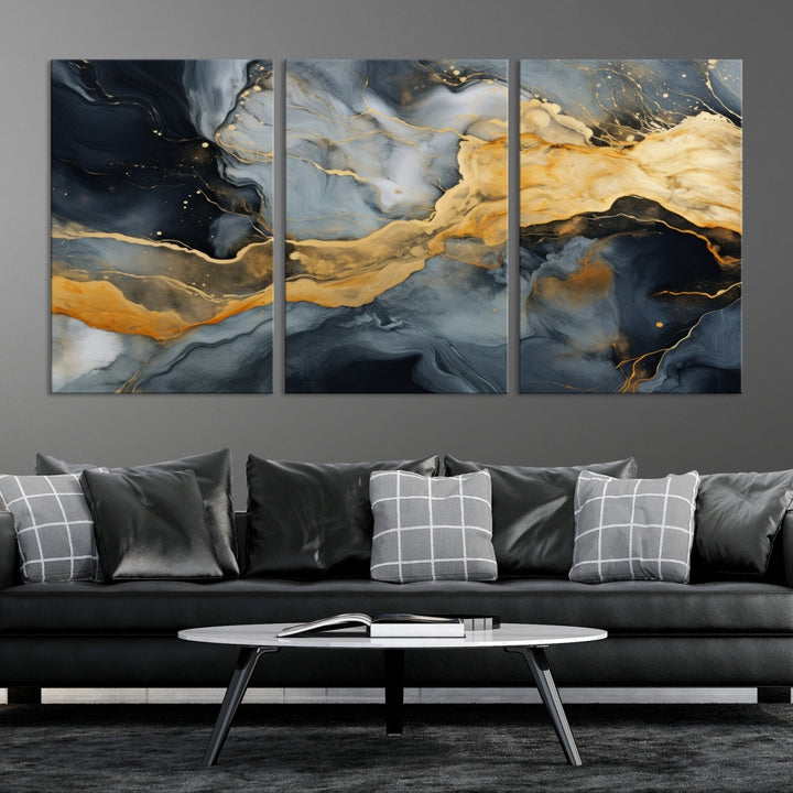 The living room features the Golden Gray Abstract Wall Art Print Contemporary Art Canvas Design, a triptych showcasing gold, black, and gray swirls. Crafted on museum-quality canvas and ready to hang, this piece is designed for elegance and durability.