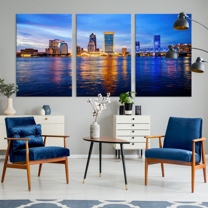 A cozy living room features the Jacksonville Wall Art Canvas Print, a large triptych crafted on museum-quality canvas that beautifully depicts the Jacksonville city skyline at sunset.